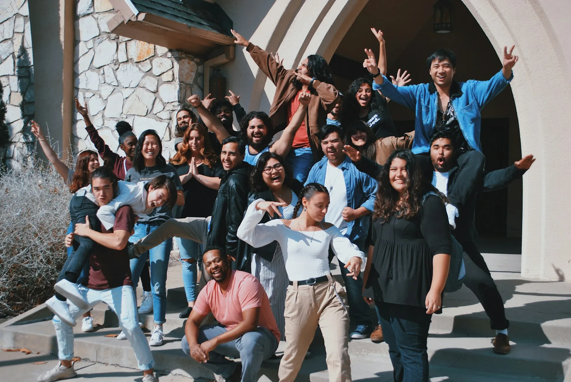 Community event with people smiling and posing for a picture
