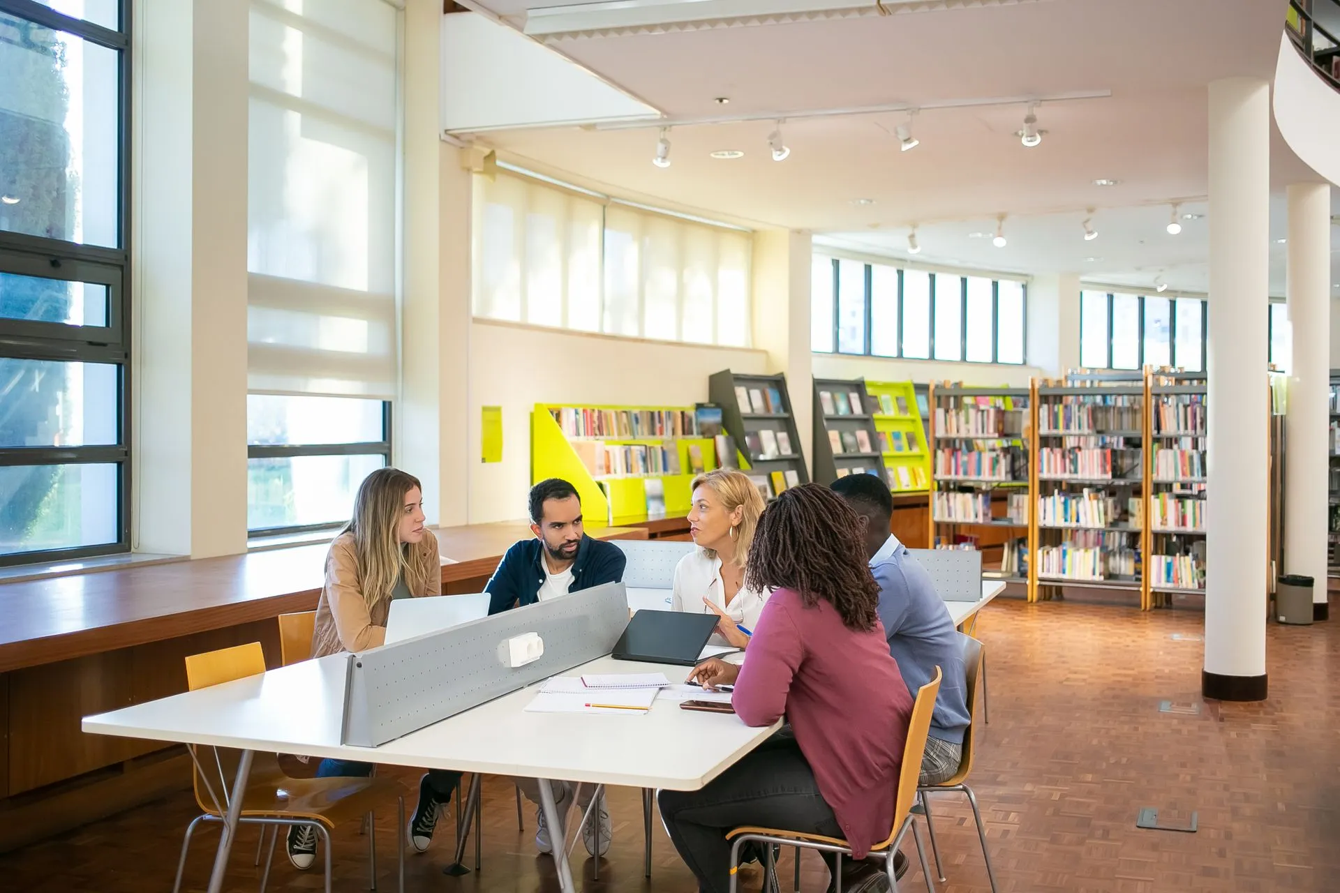 People in a library working together