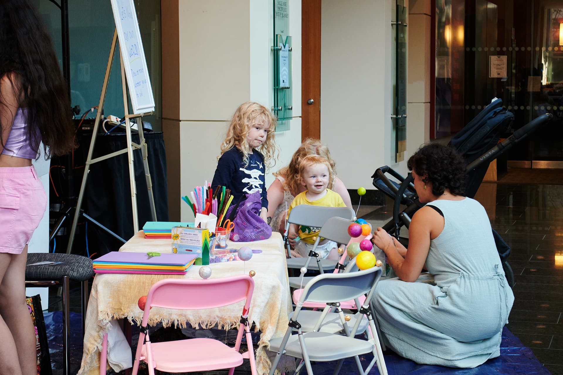 Image of children engaged in learning activities with teacher supervision